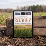 E-book „Rewitalizacja gleby” na tablecie opartym o skrzynkę na skraju pola