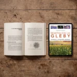 Otwarta książka „Rewitalizacja gleby” obok tabletu z e-bookiem
